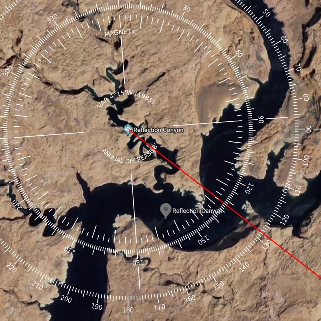 Additional photograph made by Brian Kaufman while working on "Annularity" nature-in-motion piece shows a satellite image of reflection canyon on Lake Powell with a compass overlay showing the bearing of the annular eclipse.