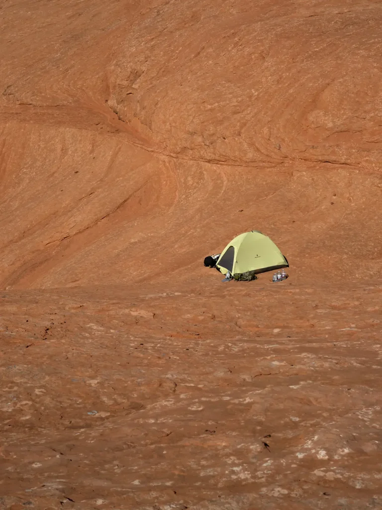 Additional photograph made by Brian Kaufman while working on "Annularity" nature-in-motion piece shows his tent pitched on desert stone