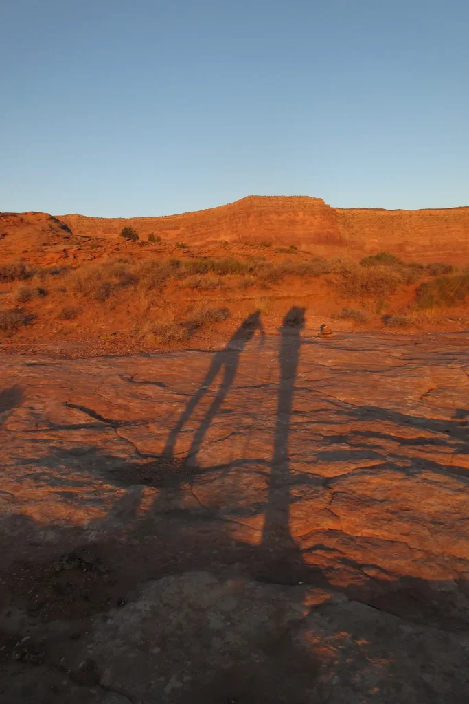 Additional photograph made by Brian Kaufman while working on "Annularity" nature-in-motion piece shows him hiking out at sunrise across the desert.