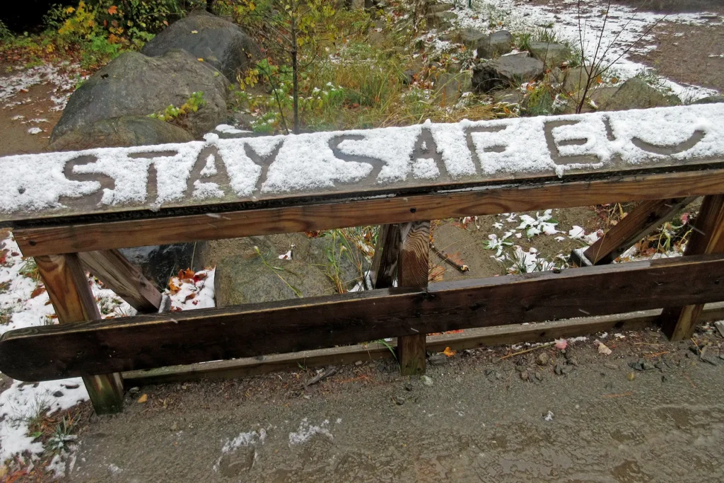 Additional photograph made by Brian Kaufman while working on "Totality" nature-in-motion piece shows a snow-covered trail with the words "stay safe" written in snow
