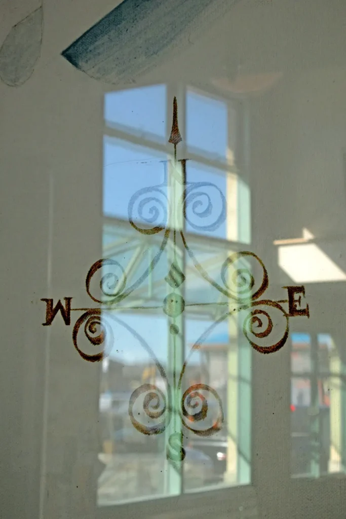 Additional photograph made by Brian Kaufman while working on "Totality" nature-in-motion piece shows a hand-drawn compass reflected behind glass