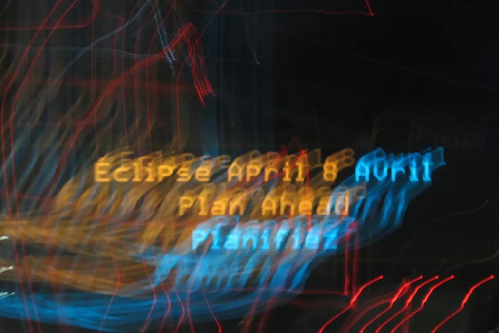 Additional photograph made by Brian Kaufman while working on "Totality" nature-in-motion piece shows a road sign telling eclipse viewers to plan ahead